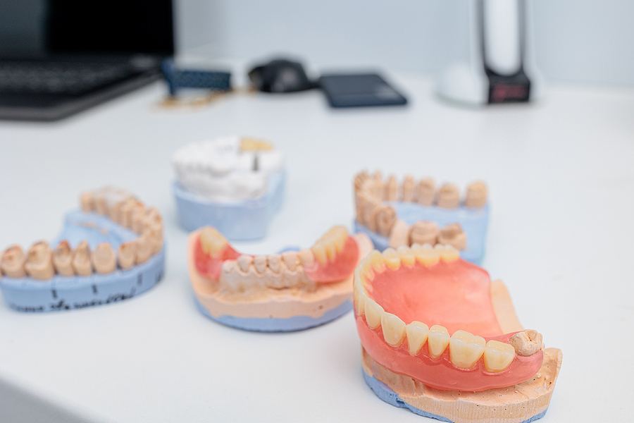 Dentures On A White Background. Close-up Of Dentures. Full Remov