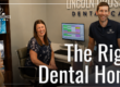 Dentist and team members smiling