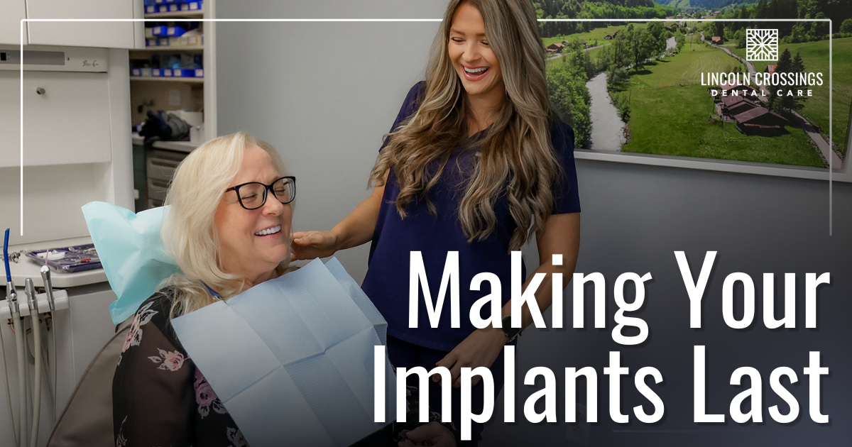 patient and hygienist smiling together